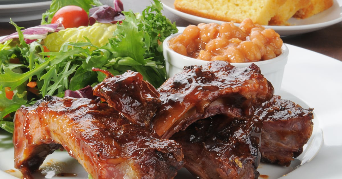 oven bbq ribs plated with beans, salad