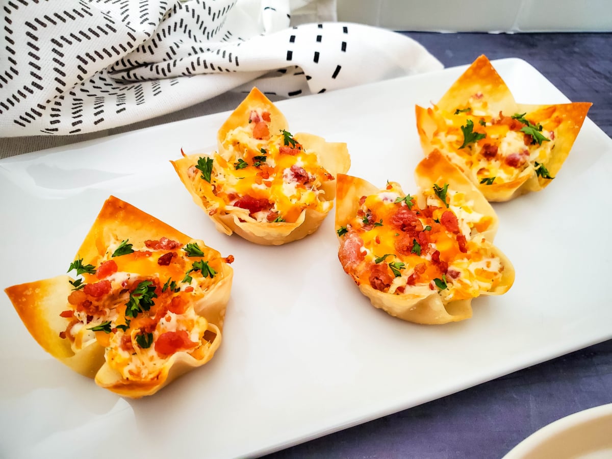 chicken ranch cheese wonton cups on a white platter