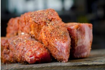 pile of uncooked ribs, seasoned with dry rub country style ribs ready for the air fryer