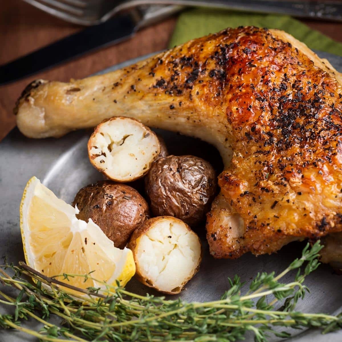 baked chicken leg quarter with roasted potatoes