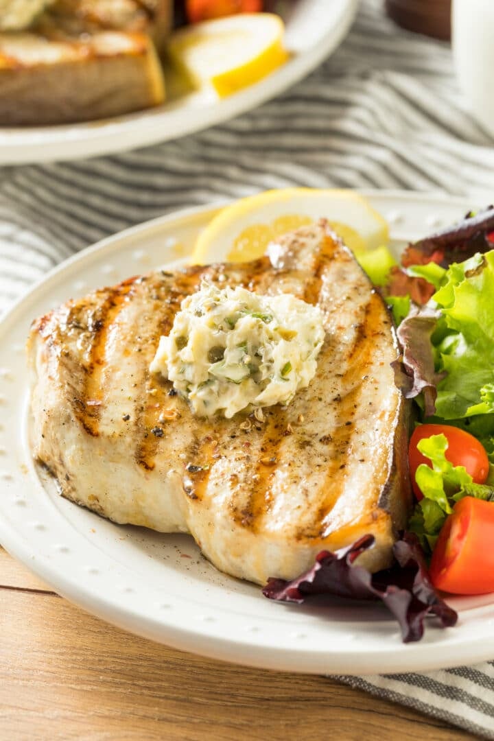 baked swordfish recipe with garlic butter and side green salad