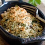 baked tilapia in a oval black casserole dish - example of an easy dinner idea