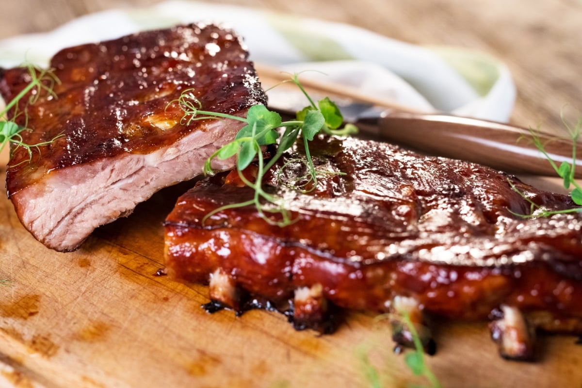 baby back ribs slather with sauce and cut into 3 bone sections
