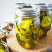 Bread and butter pickles in 3 canning jars.