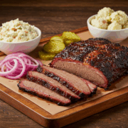 sliced brisket with coleslaw and pickles