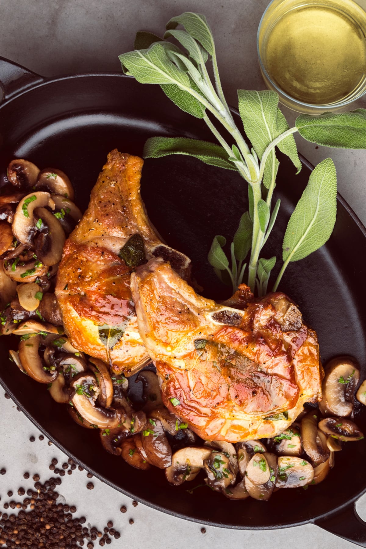 cast iron skillet pork chops with herbs and mushrooms