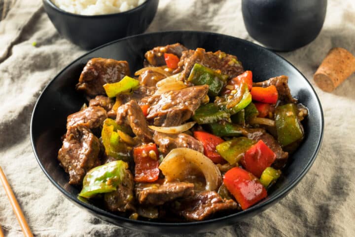 Pepper steak and onions landscape ivew closeup.