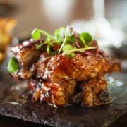 closeup of country style ribs oven baked with bbq sauce