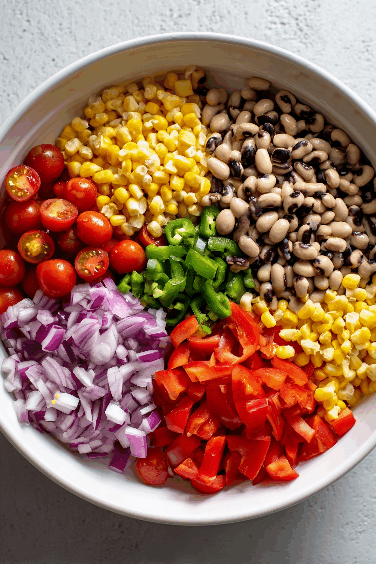 cowboy caviar ingredients in a bowl before mixing