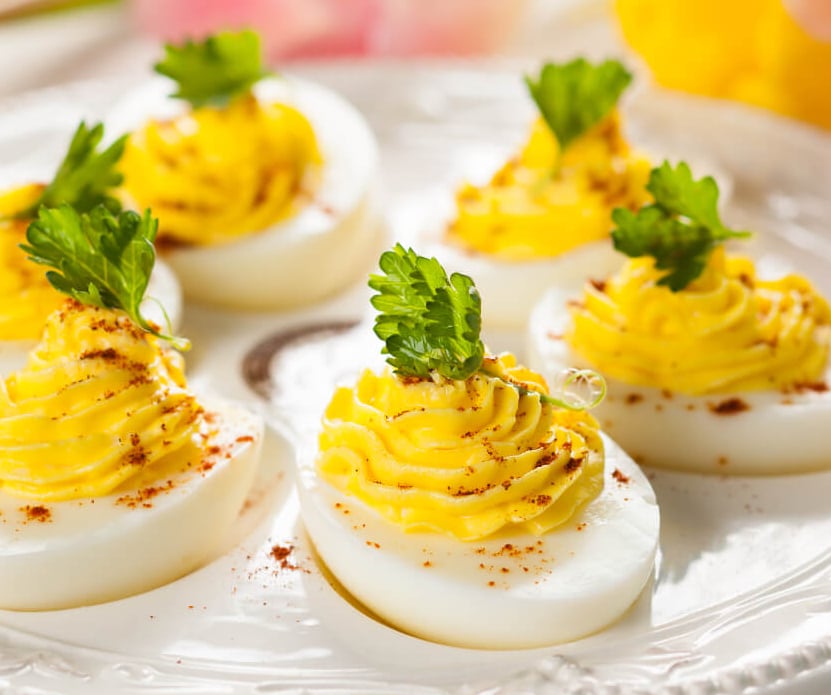 deviled eggs garnished with paprika 