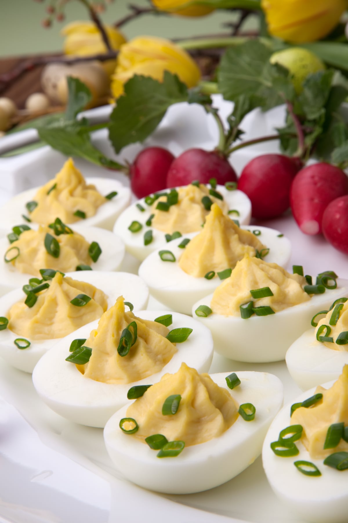 deviled eggs garnished with sliced green onions