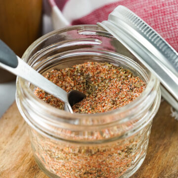 glass jar with spoon of dry rub for country style pork ribs