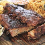 stack of dry rub ribs with side dishes