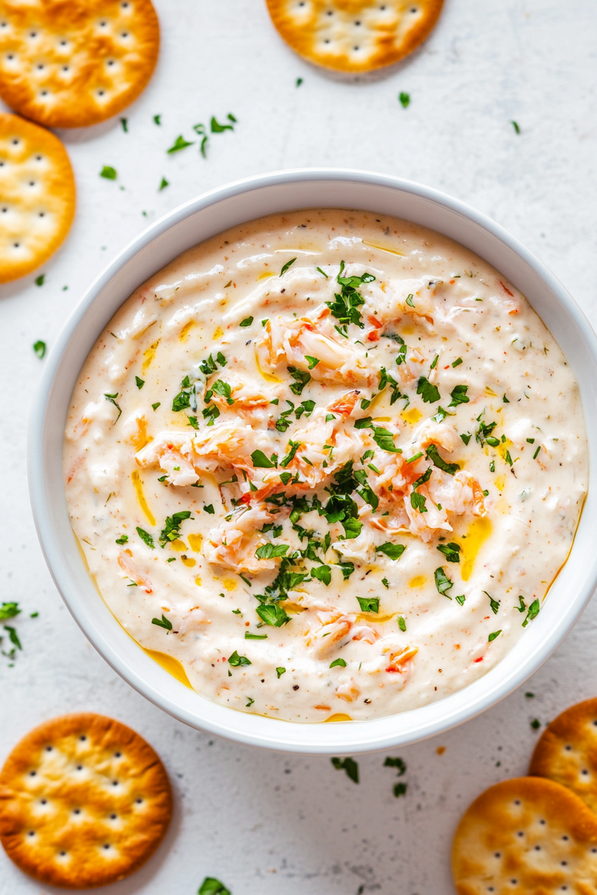 overhead view of cold crab dip served with crackers