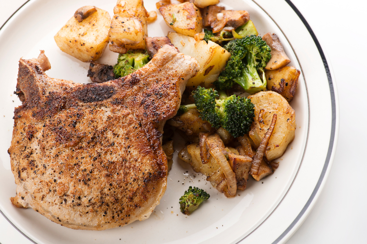fried pork chops plate with side dishes