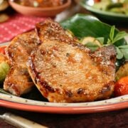 Pan Fried Pork Chops with nicely browned exterior ready to serve.