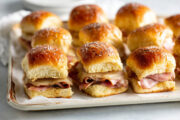 Easy Ham and Cheese Sliders on Hawaiian Rolls tray full of ham and Swiss sliders for a party