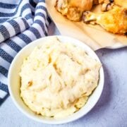 creamy garlic parmesan sauce in a white bowl ready for dipping