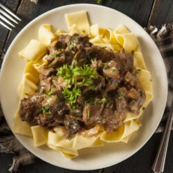 Instant Pot beef stroganoff over buttered egg noodles