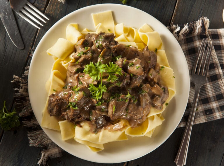 Instant Pot beef stroganoff over buttered egg noodles