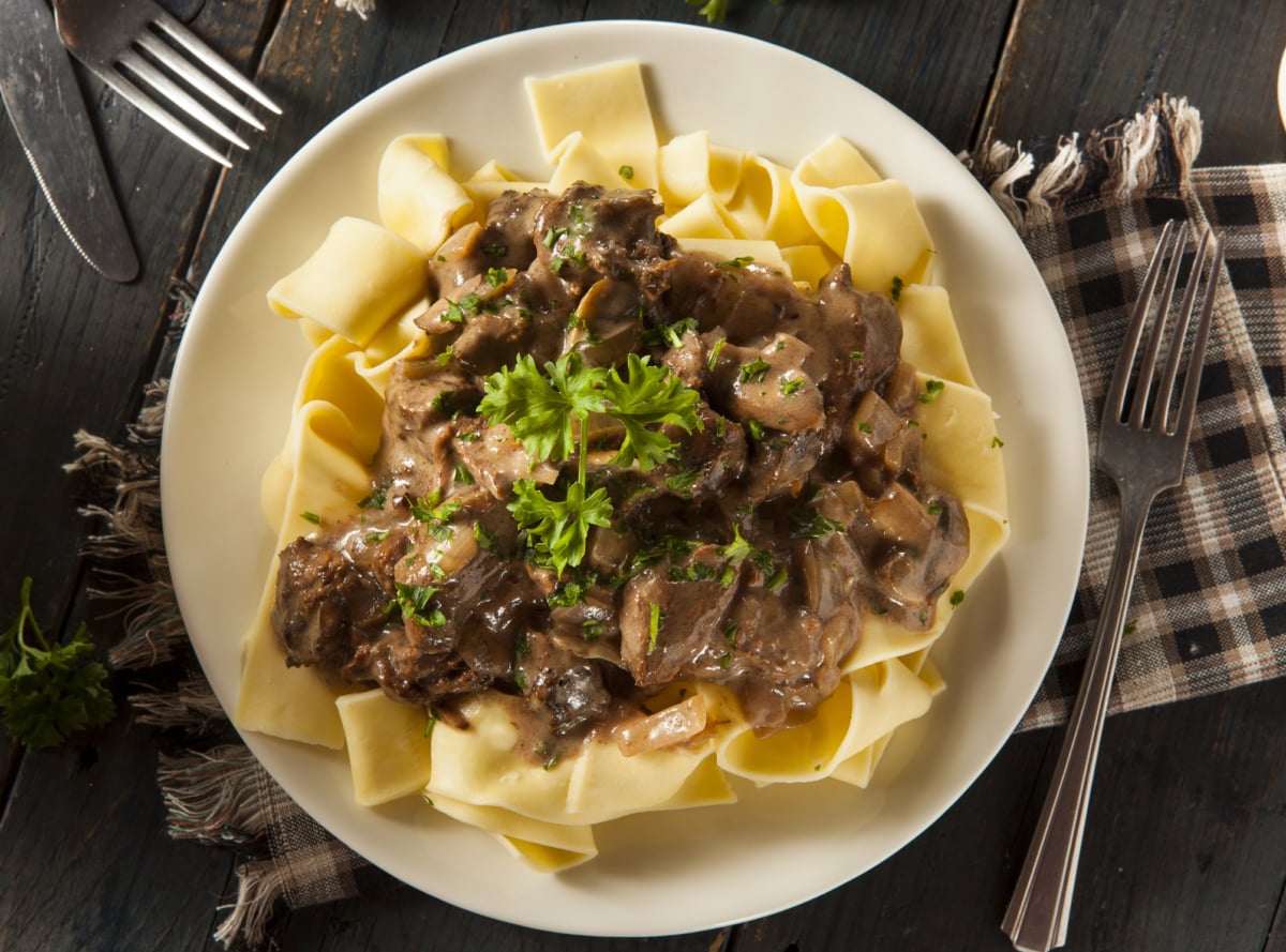 Instant Pot beef stroganoff over buttered egg noodles