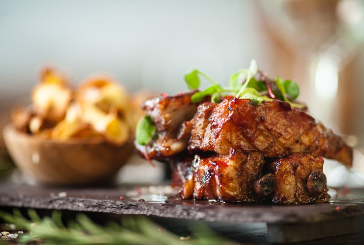 side view of country style ribs with sauce
