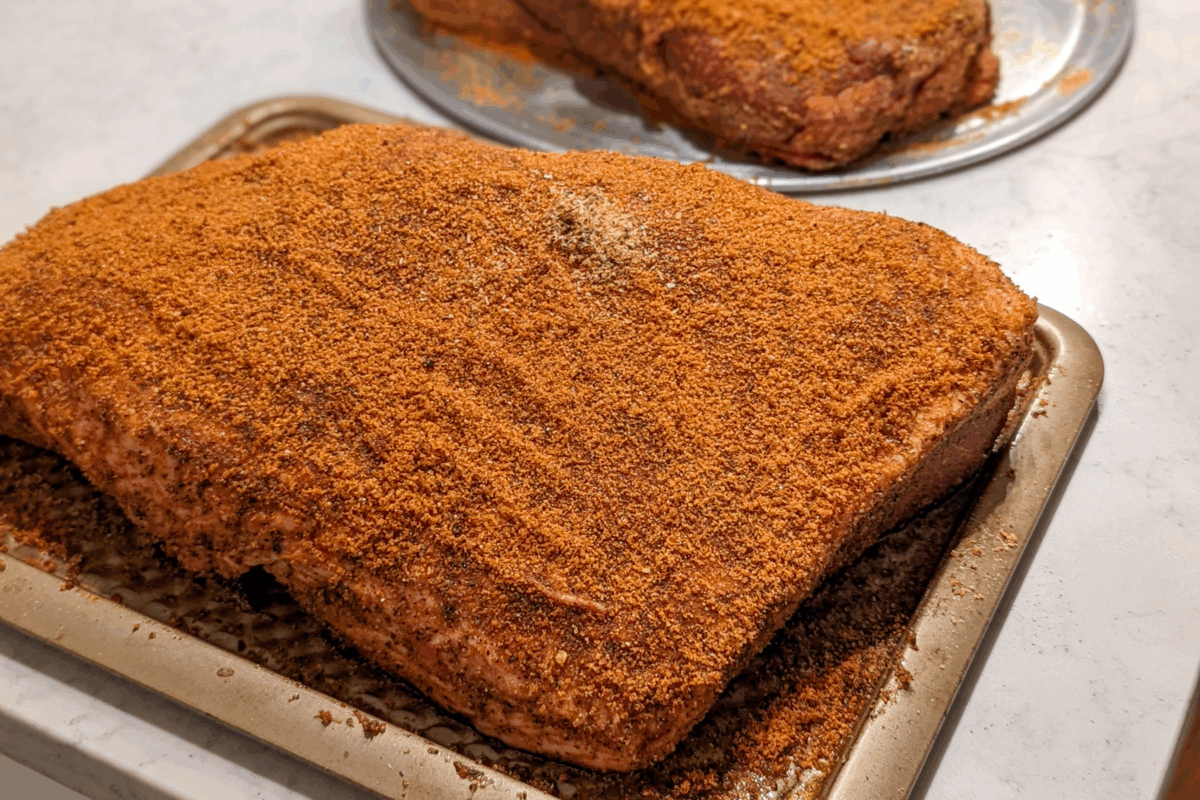 seasoned raw brisket on tray