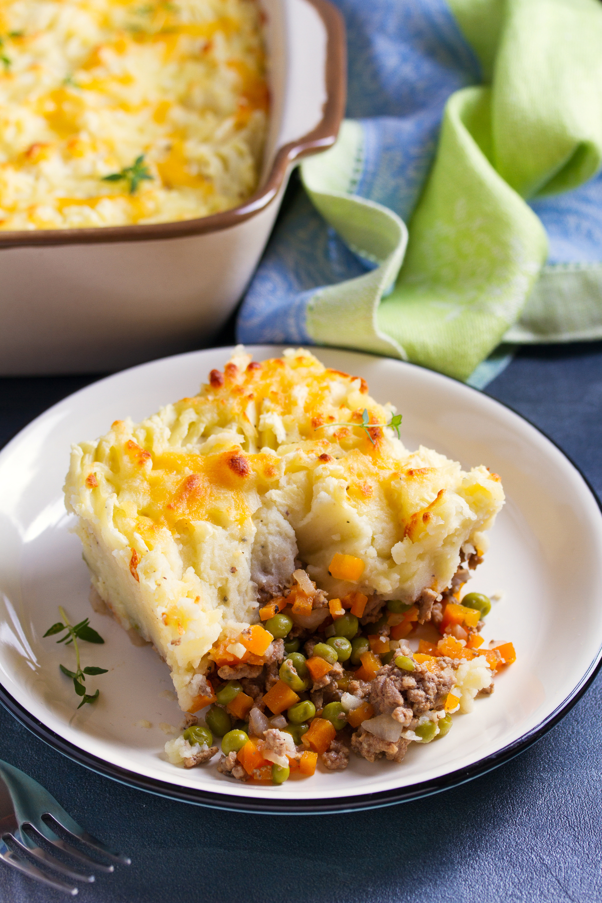 classic shepherds pie served on a white plate for Sunday dinner